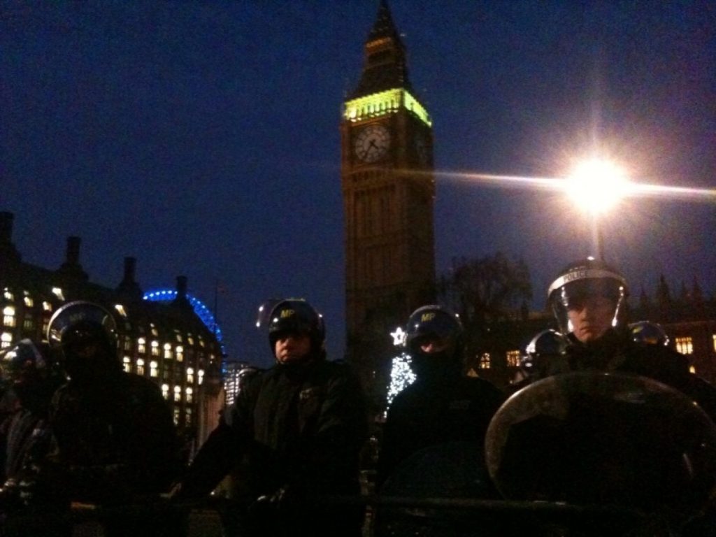 Police stand guard during the student protests last December