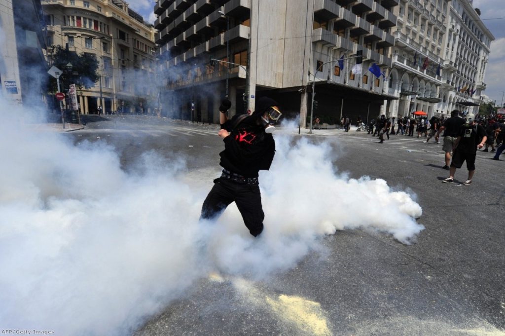 Protesters clash with riot police during a 24-hour general strike on June 28, 2011 in Athens. ARIS MESSINIS/AFP/Getty Images