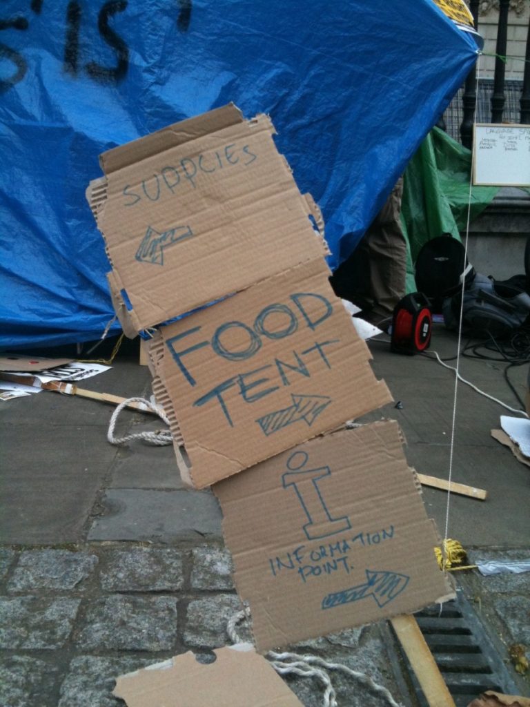 A hastily scrawled sign indicates what's on offer outside St Paul's.