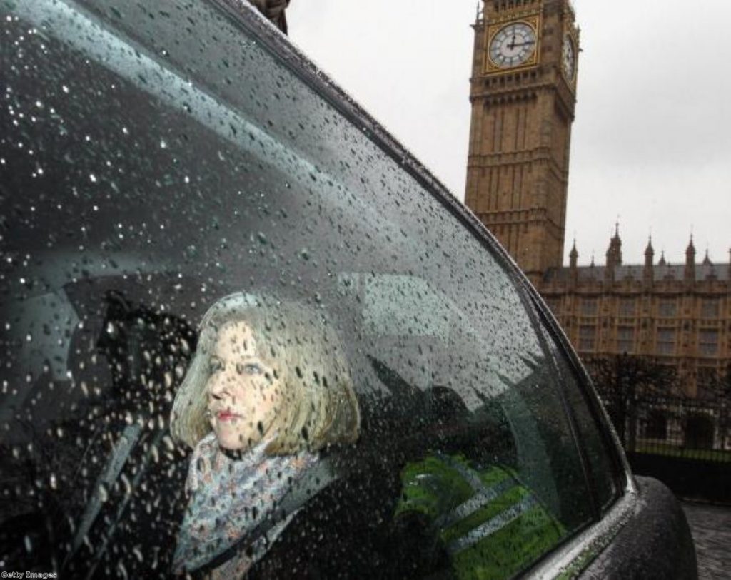 Theresa May puts on a brave face as pressure builds over border checks