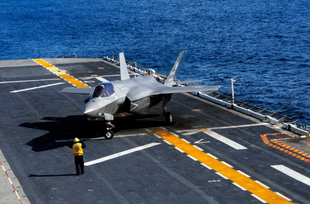 An F35-B aircraft lands on a US Navy vessel