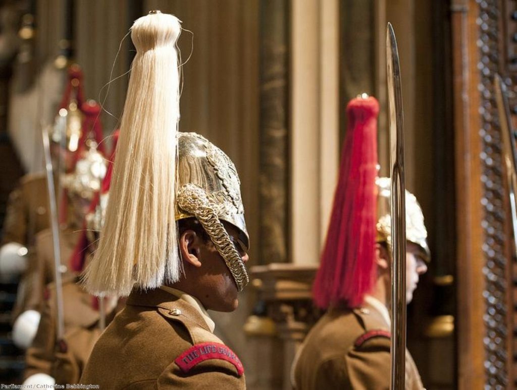 Household Cavalry stand guard in parliament for the Queen