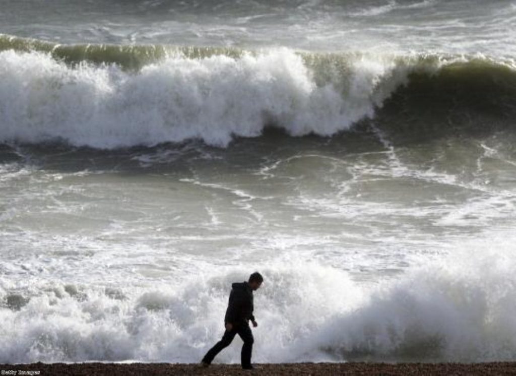 Hint: The man is the Lib Dems. The waves are the voters. Or something.