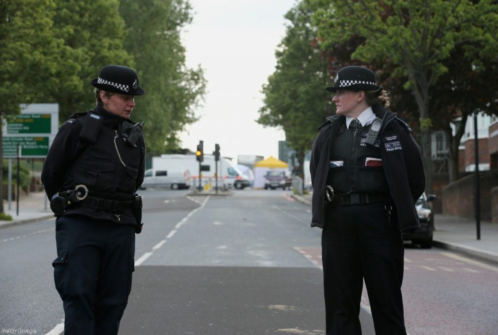 Police near to the scene in Woolwich following a major incident in which a man was killed
