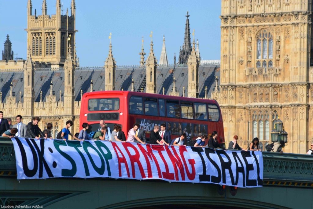 A 75-foot banner is unfurled along Westminster Bridge 