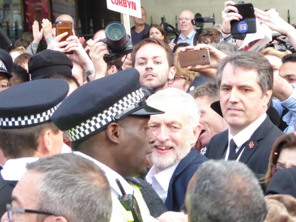 Jeremy Corbyn surrounded by supporters outside Parliament
