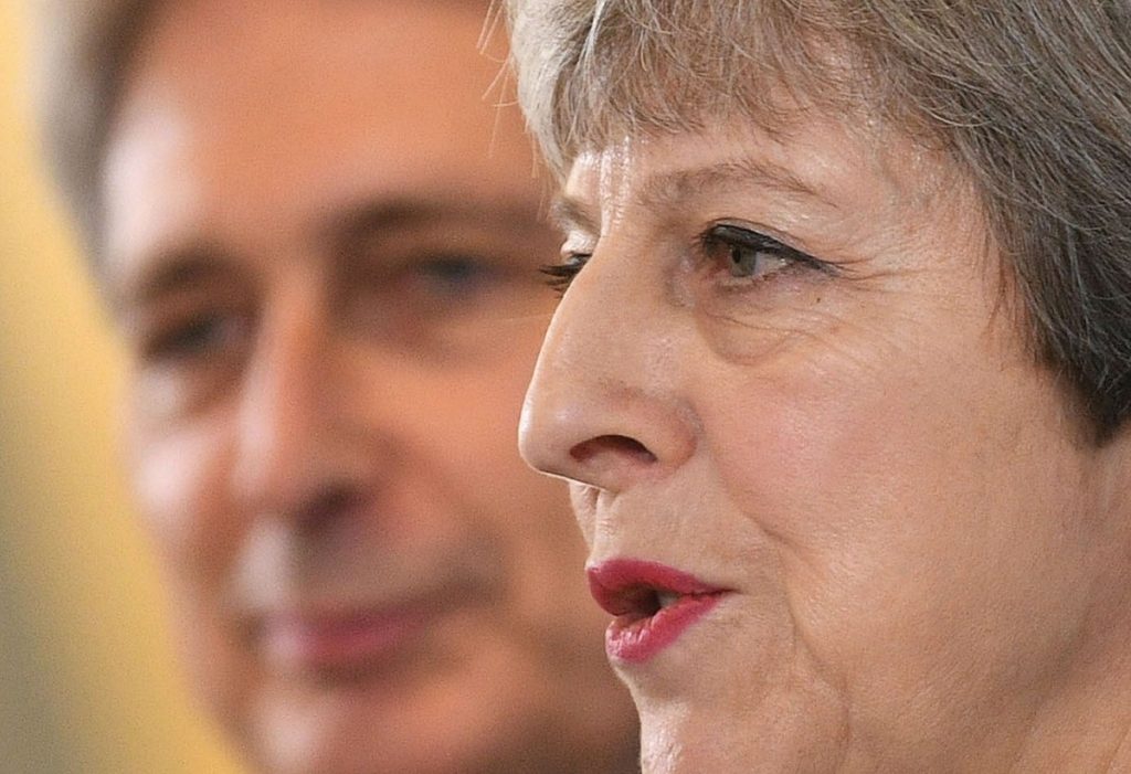 May and Hammond speaking in Canary Wharf in east London this morning 