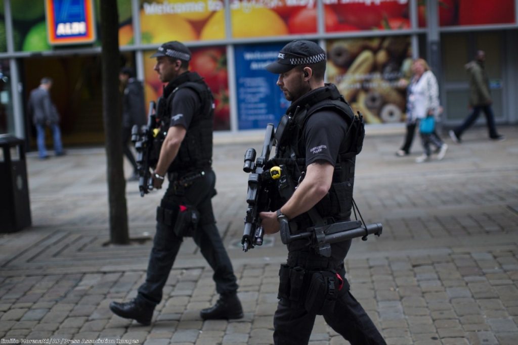 Police officers patrol in central Manchester after Monday