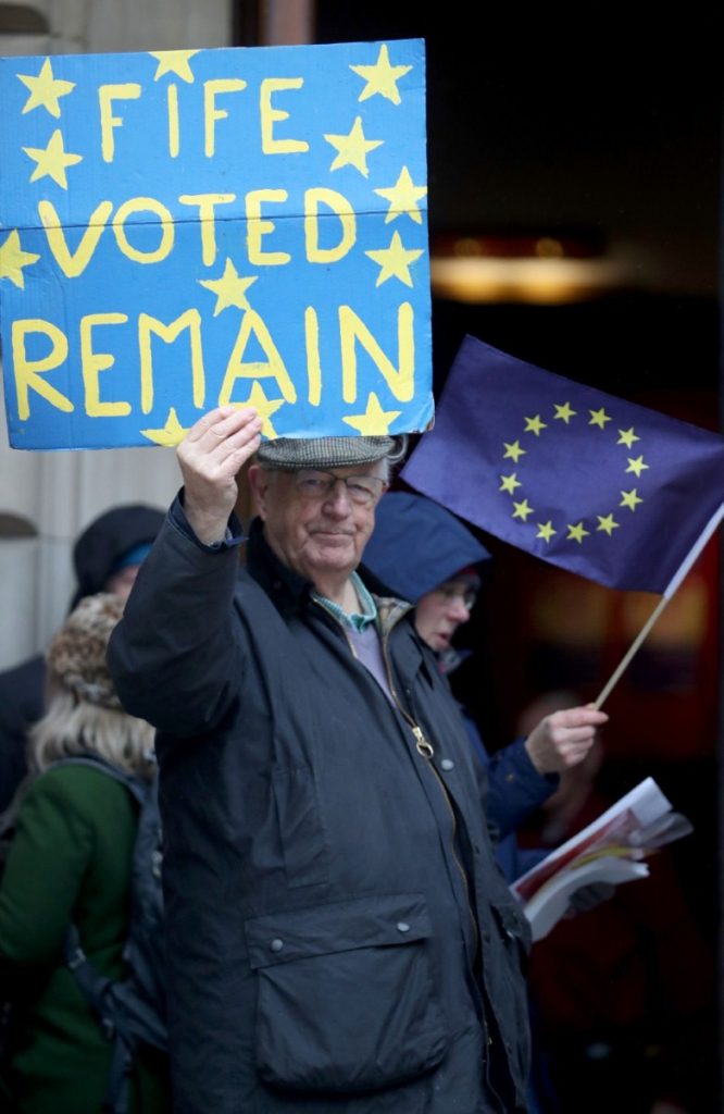 A member of the European Movement in Scotland demonstrates outside the Scottish Labour conference in Dundee 