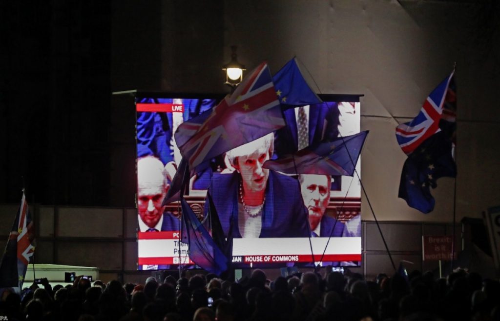 People's Vote protestors watching May's defeat on a large screen outside parliament