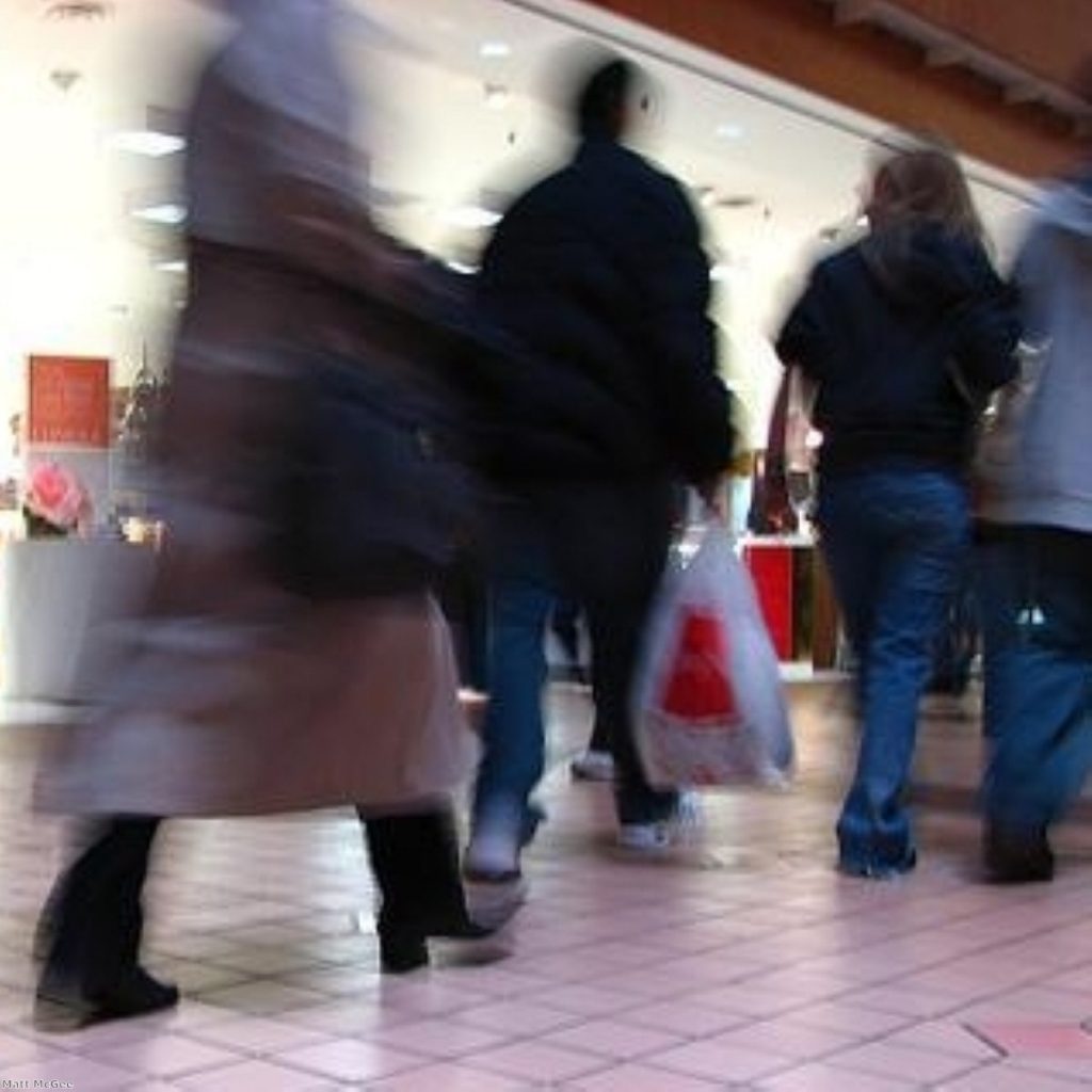 Shoppers go about their business as candidates gather support