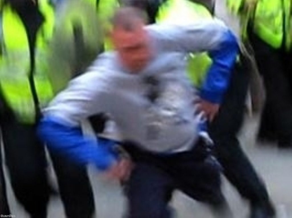 Ian Tomlinson as he was struck by police during the G20 protest