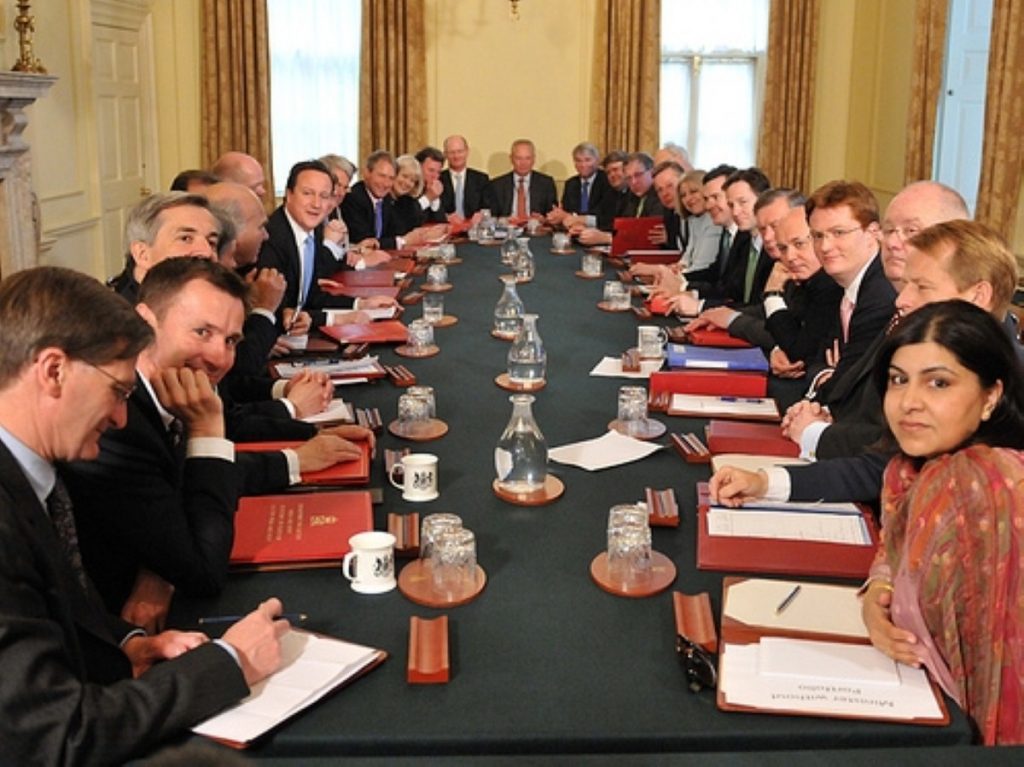 Happier days? Warsi, on the right, and Huhne, three back on the left, are engaged in a bad-tempered public dispute.