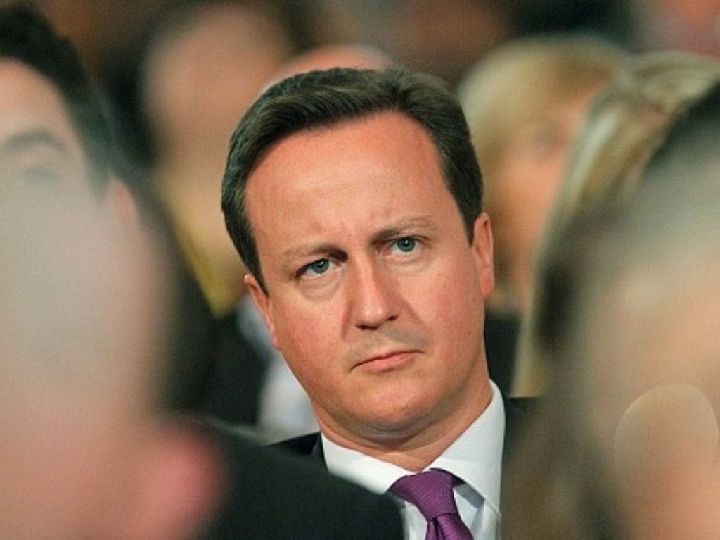 Cameron amid the Tory rank and file during party conference. The leader will face opposition to the policy from within the party.